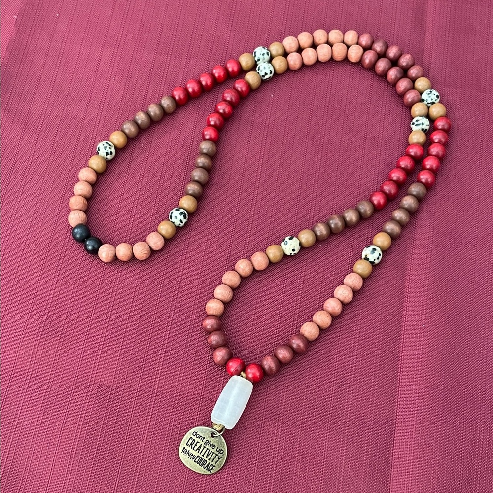 Hand assembled beaded necklace courage.